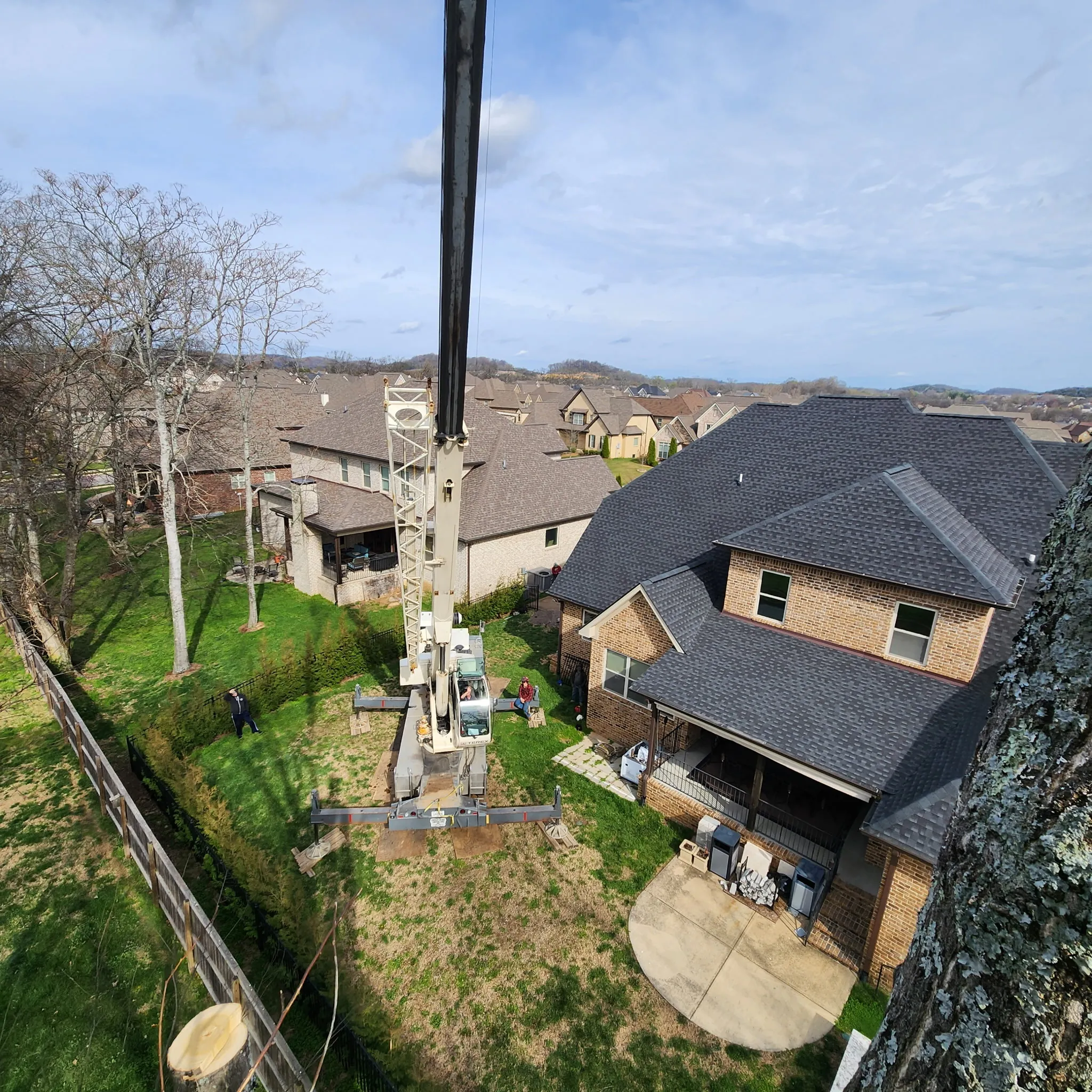 Aerial view of crane over neighborhood